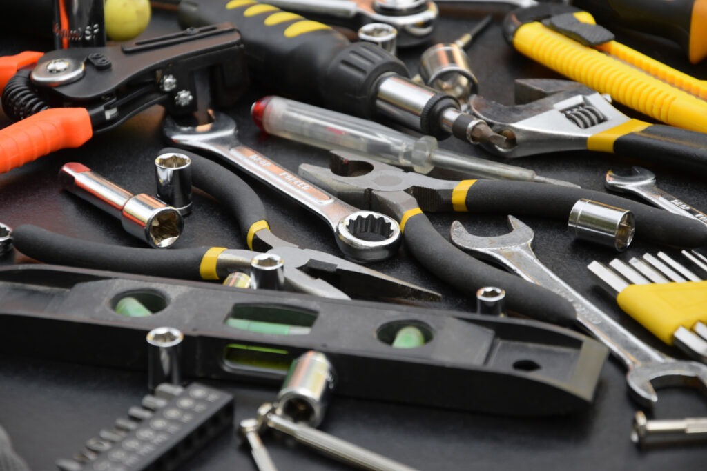 Handyman,Tool,Kit,On,Black,Wooden,Table.,Many,Wrenches,And
